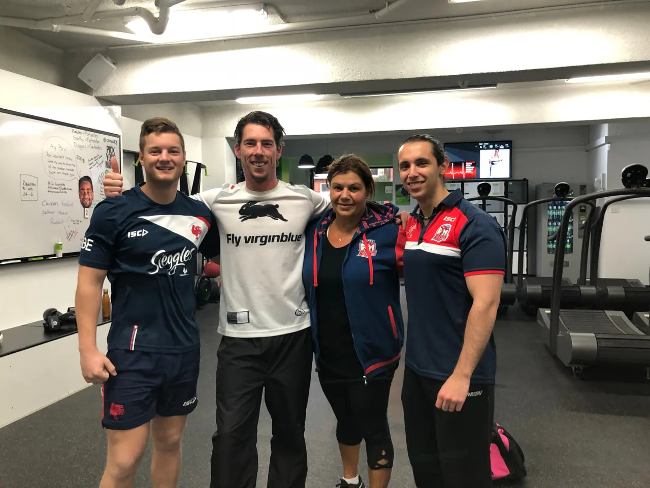 The 6X Training coaching team — four personal trainers smiling together on the gym floor at the Maroubra studio